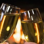 champagne toast in front of a fire