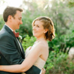 Happy wedding couple holding each other