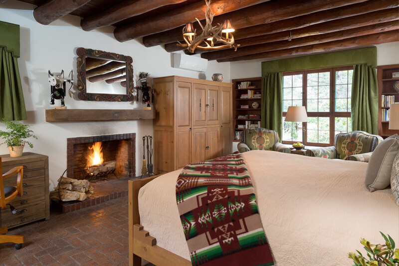 Cozy Southwestern bedroom with fireplace in Santa Fe