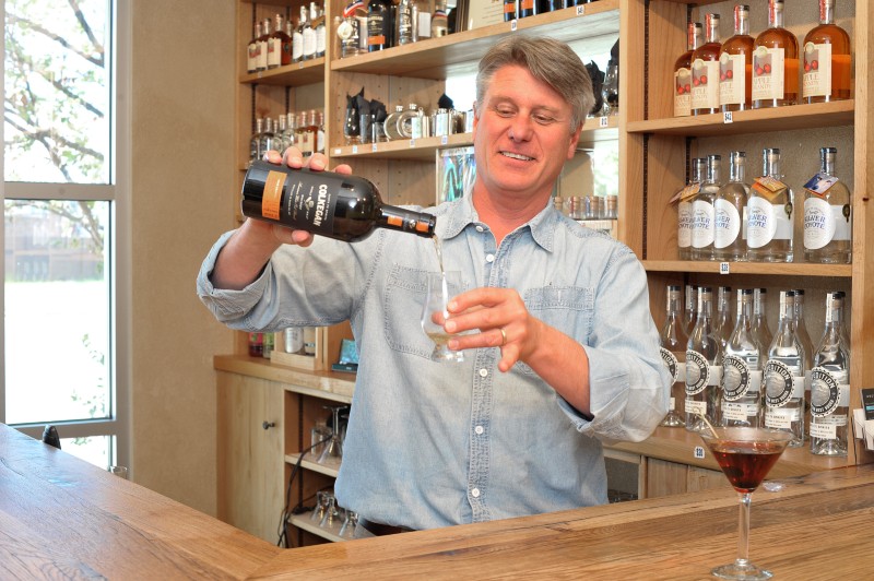 owner of Santa Fe Spirits pouring a drink