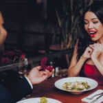 man with ring during romantic dinner proposal