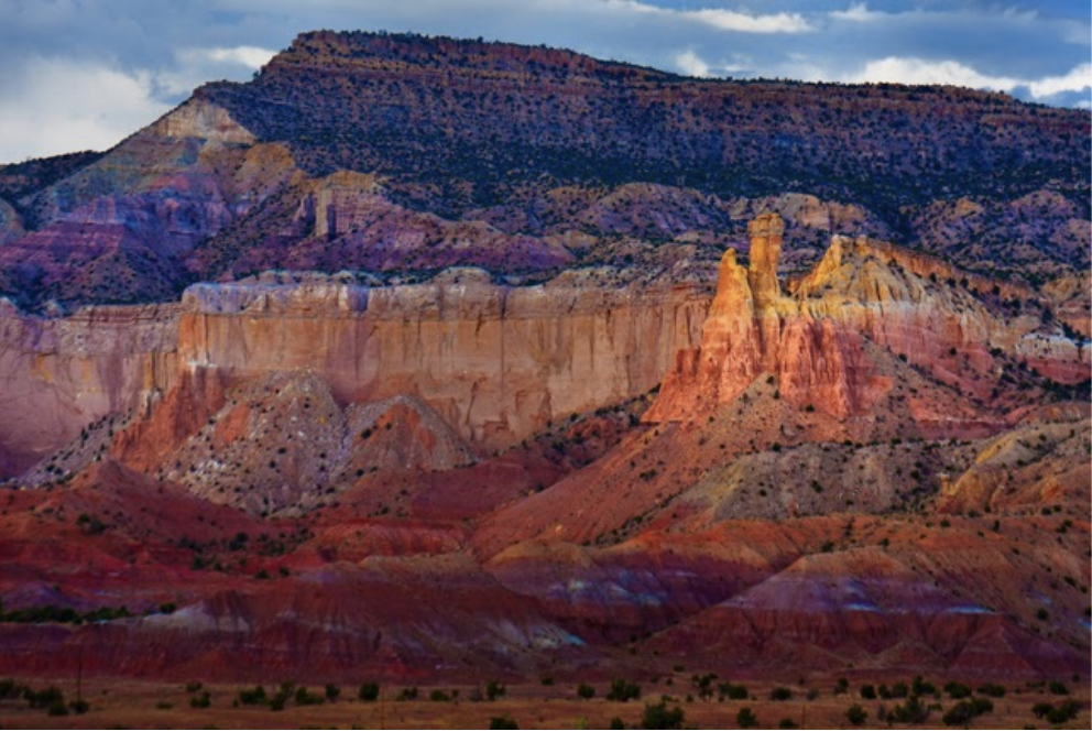 New Mexico mountains in shades of pink, burgundy and purple