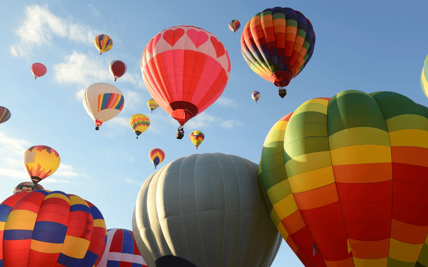 Colorful hot air balloons rising into the sky.