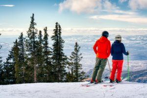 Couple at snow skiing at top of mountain ski santa fe