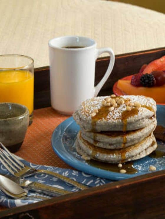 Plate of Blue Corn Pancakes, bacon and juice