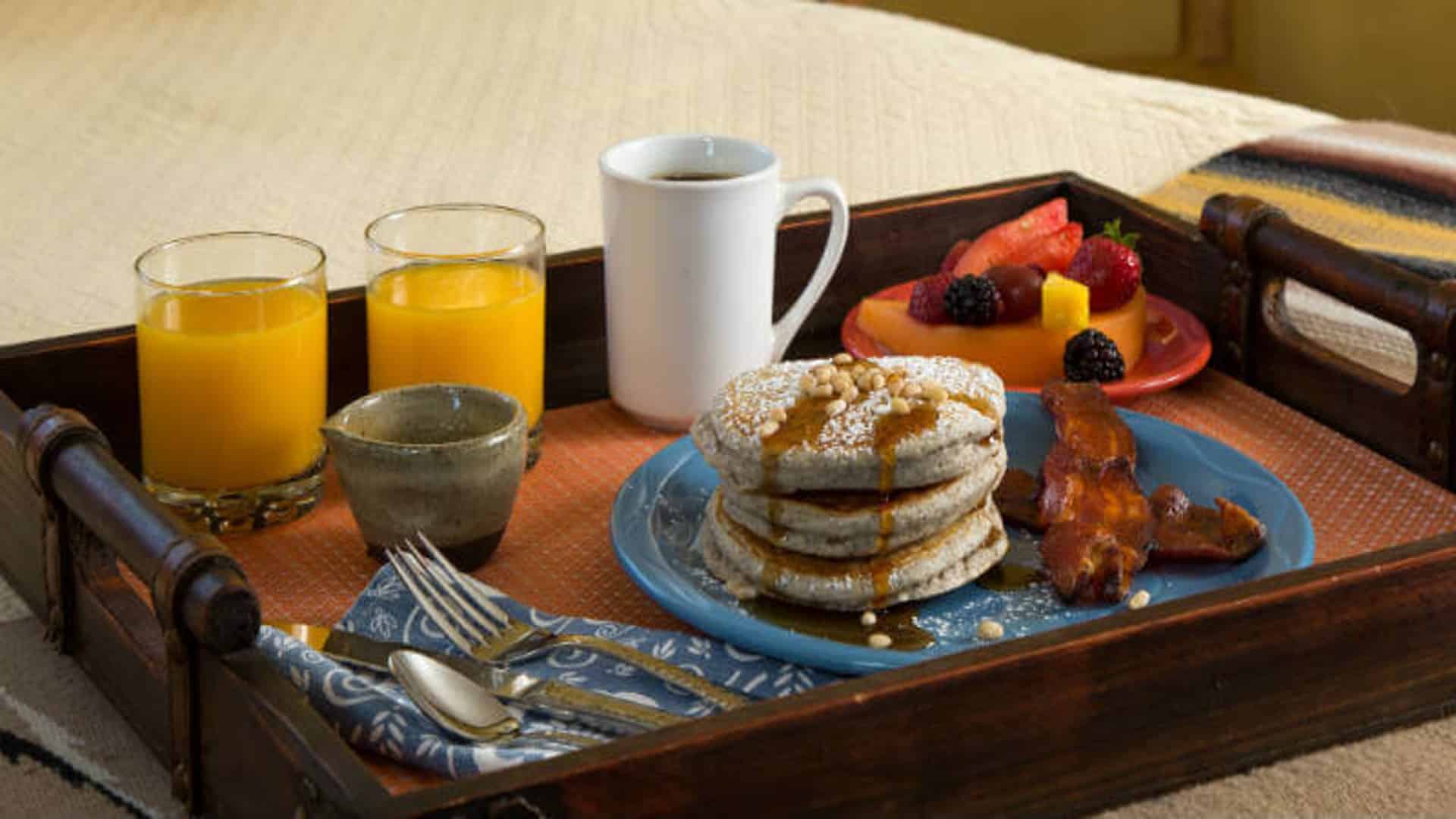 Plate of Blue Corn Pancakes, bacon and juice