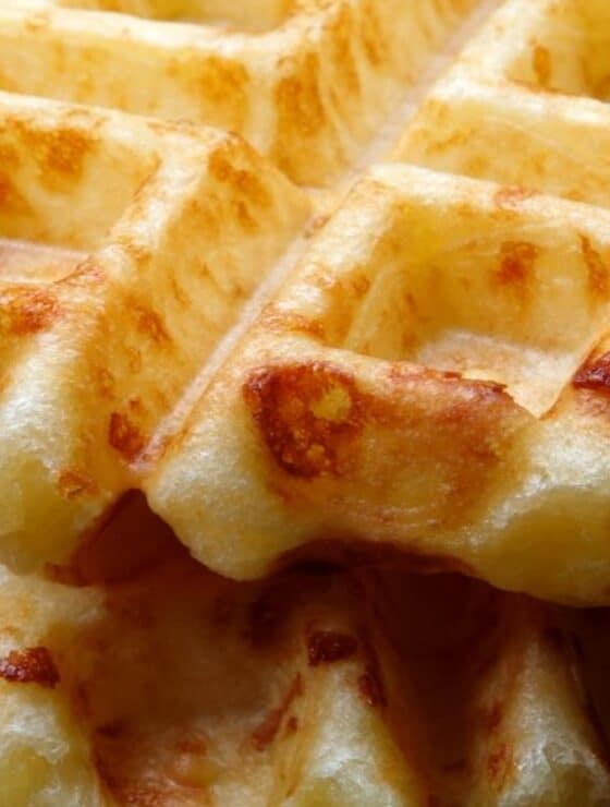 Close up of a stack of golden brown savory waffles