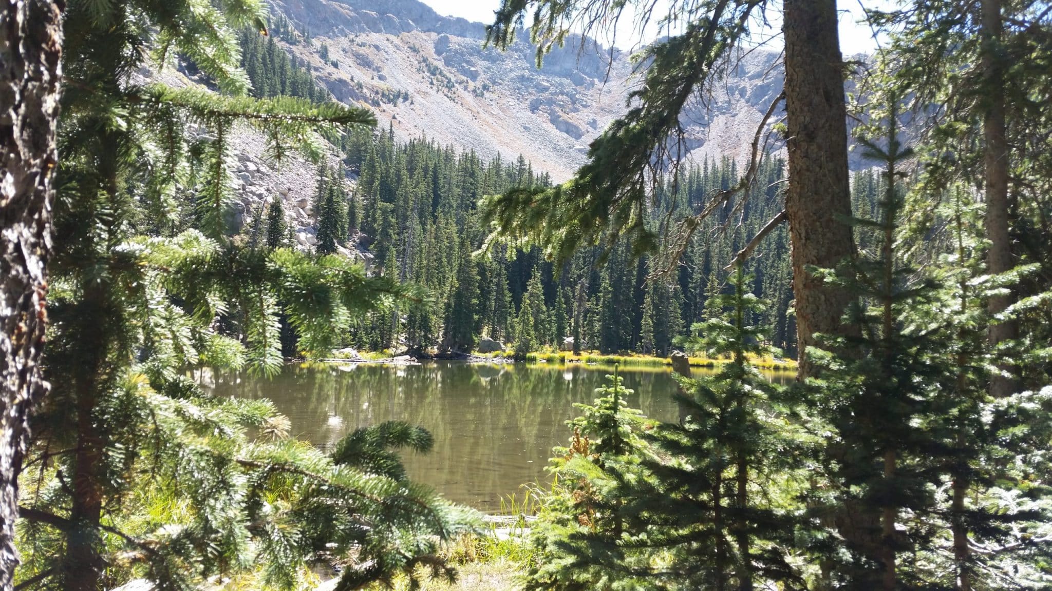 View of Santa Fe's closest Alpine Lake. Nambe Lake.||Beautiful Lake Katherine in NM against a backdrop of snow-topped mountains and deep green pine trees.|