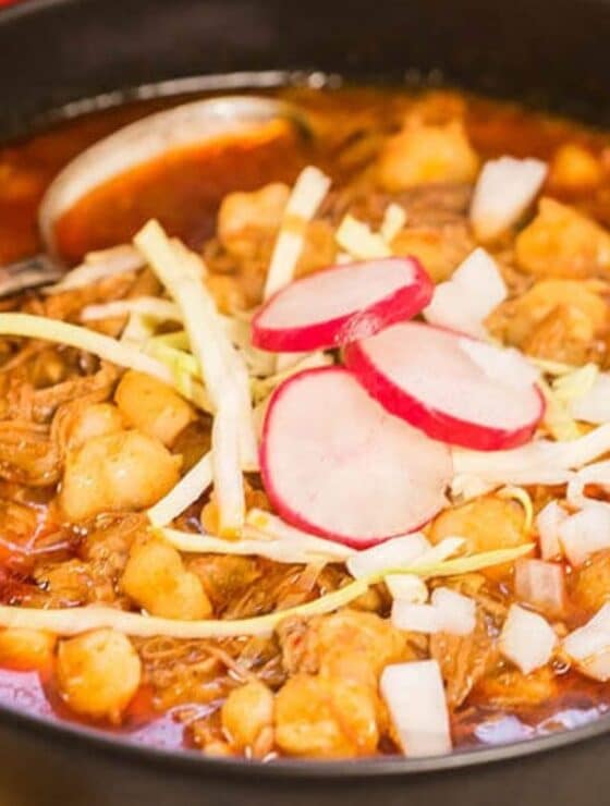 Bowl of New Mexico Posole Rojo with sliced cabbage, radish.