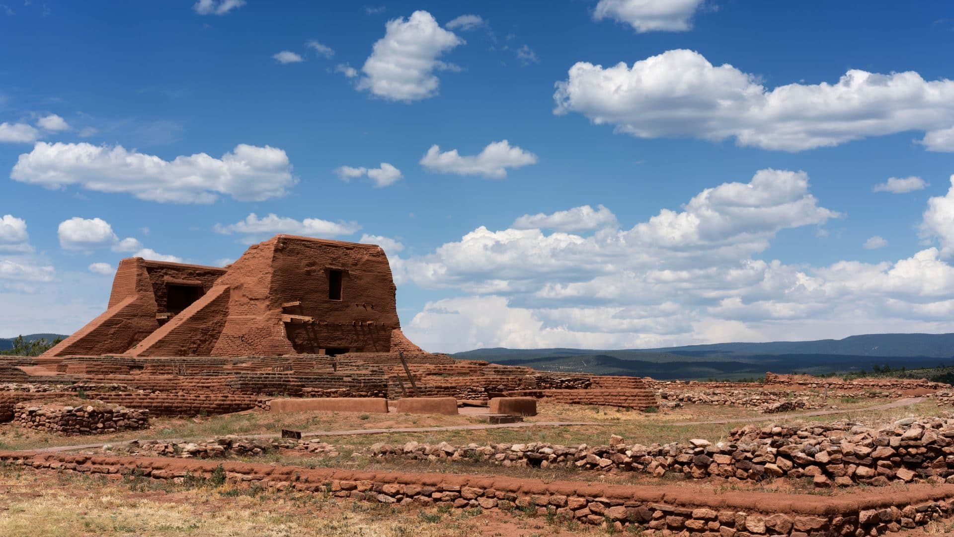 Adobe structure in Pecos, NM against bright blue skies