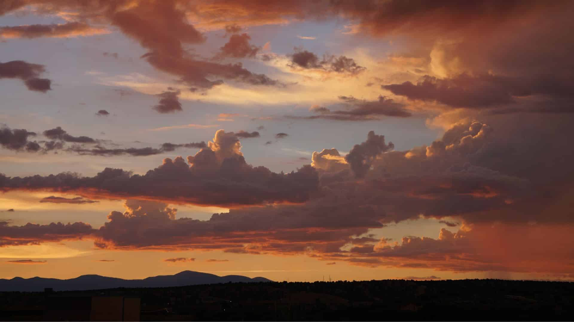 Gorgeous pink and peach sunset over the hills in Santa Fe, NM
