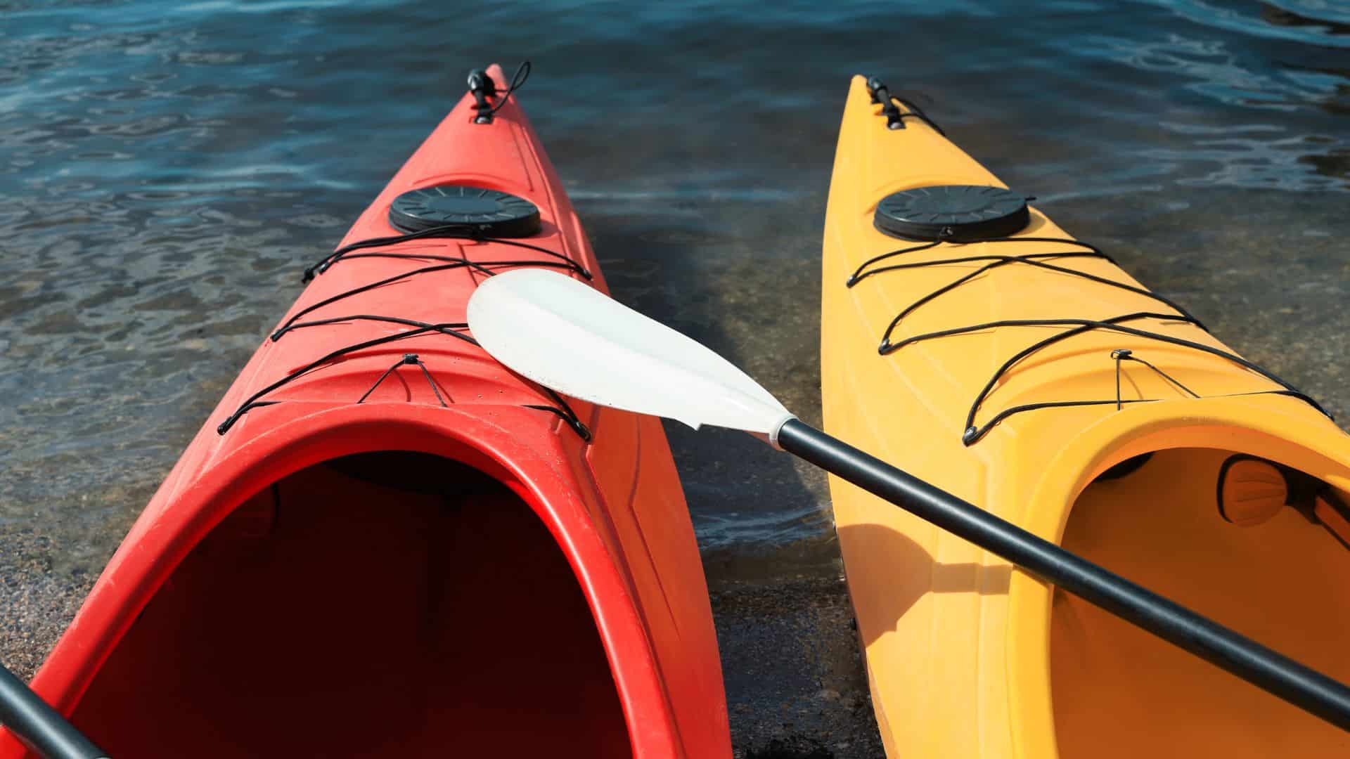 red and yellow kayaks at the shore