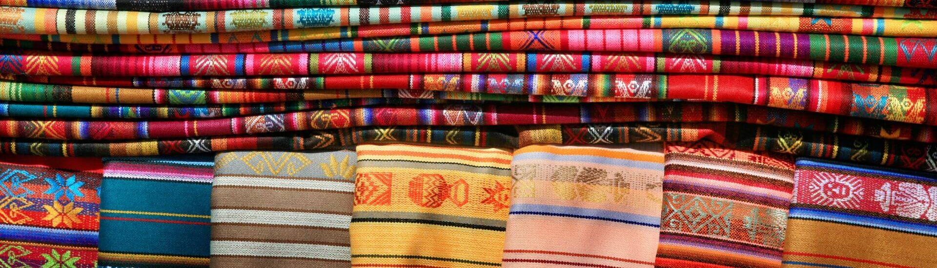 colorful blankets and mexican tablecloths at the santa fe market