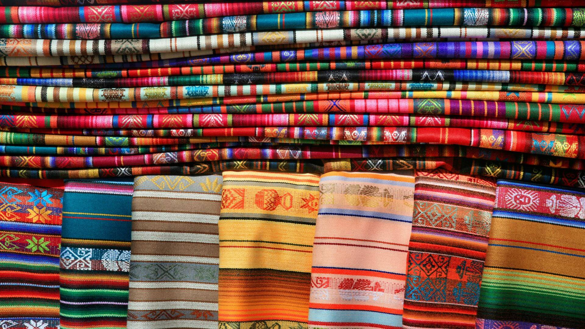 colorful blankets and mexican tablecloths at the santa fe market