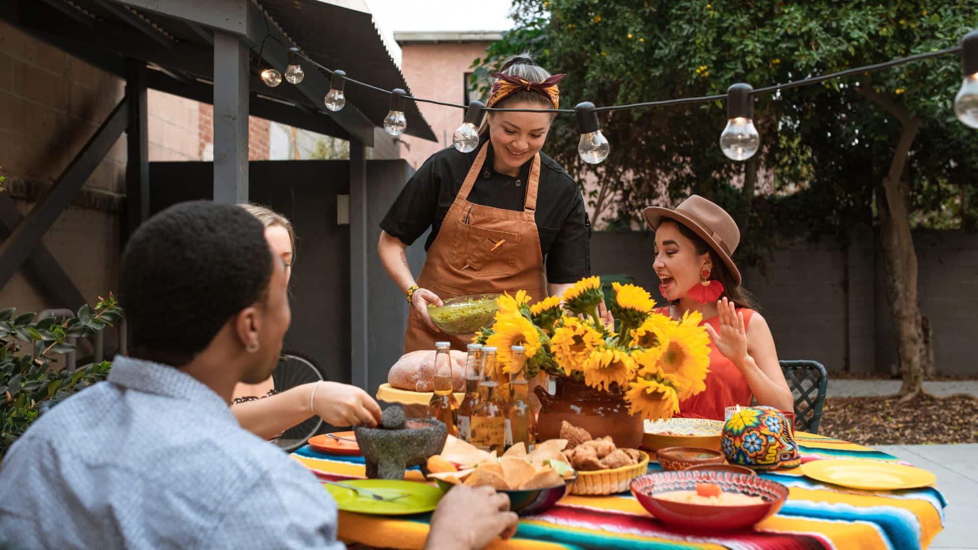 a group eats out on a patio at a mexican restaurant