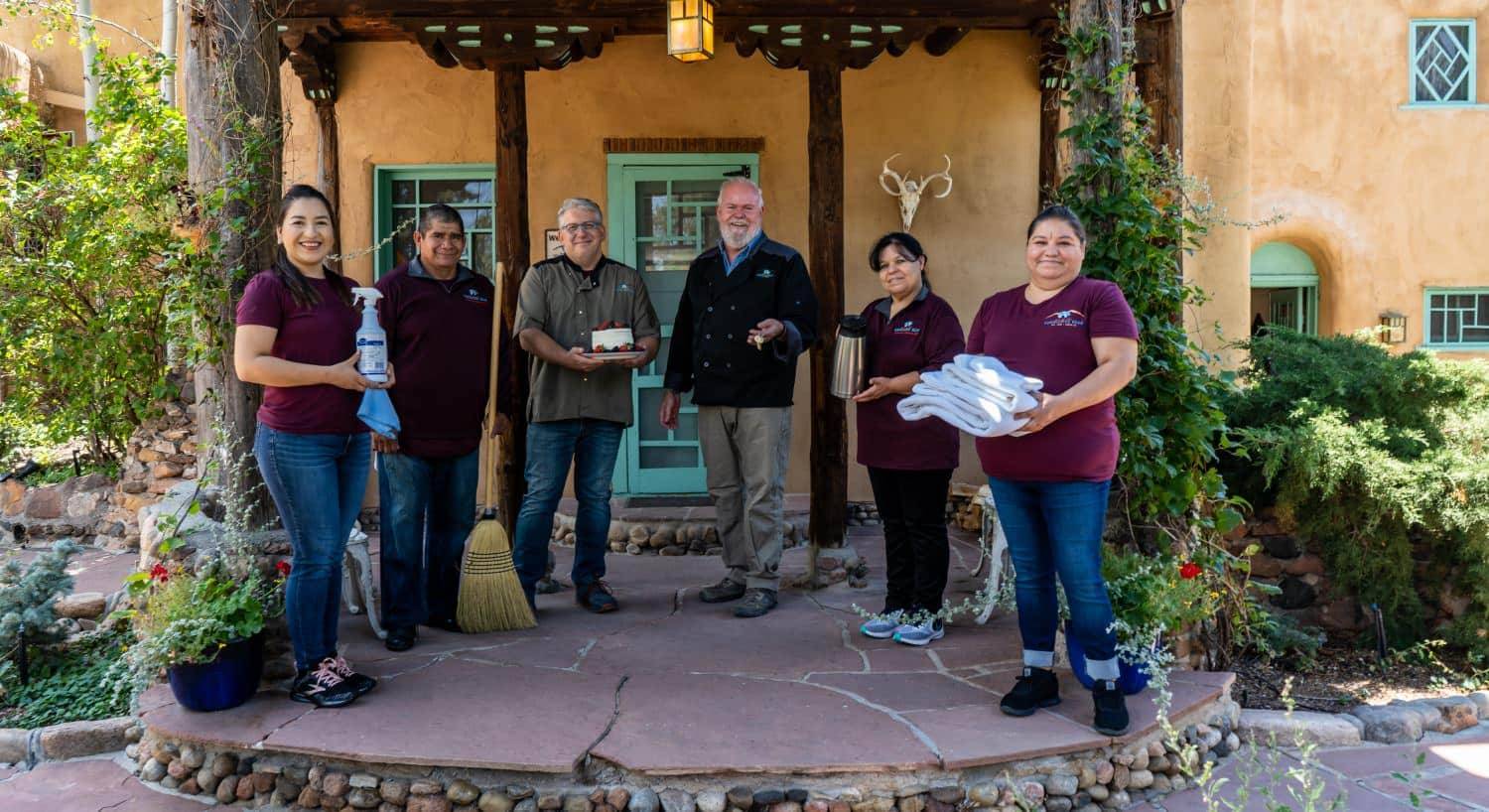 Inn of the Turquoise Bear staff standing outside on stone patio